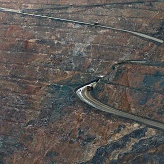 free-photo-of-massive-open-pit-mine-with-haul-trucks image